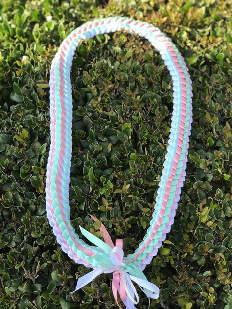 3 color ribbon lei tutorial - Learn how to make a double braided lei with four ribbons!***This video is a companion to a blog post, not a complete, stand alone tutorial*** See the post a...
